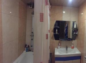 a bathroom with a sink and a shower curtain at Nice apartment nearby Garegin Nzhdeh metro, Yerevan in Yerevan