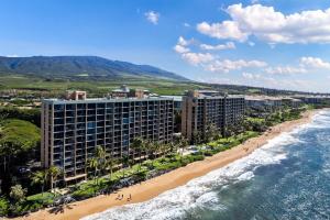 an aerial view of the beach and buildings at Mahana 718 in Lahaina
