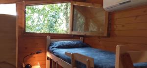 a bed in a room with a window at El Respiro in Victoria +5 photos