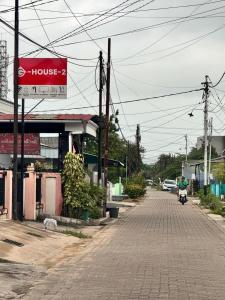 an empty street with a sign on a building at G-House-2 in Singkawang