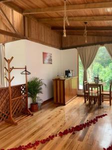 a living room with a table and a dining room at La Casa de Martin in Baños