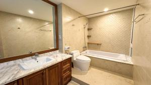 a bathroom with a sink and a tub and a toilet at The LH Homestay in Phú Quốc +22 photos