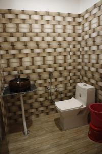a bathroom with a toilet and a sink at Shree mahal in Jāmb +8 photos