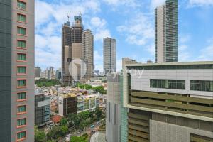 a view of a city skyline with tall buildings at Rosen by Kozystay - Thamrin in Jakarta
