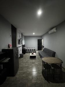 a living room with a couch and a table at Loft en tequila Jalisco in Tequila