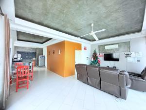 a living room with a couch and a table at Koh Chang Pool Villa Viewthalay in Ko Chang