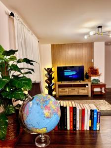 a living room with a globe and books on a table at 2BR sweet suite in Nanaimo