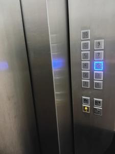 an elevator with a bunch of buttons on it at Apto completo centro in Rio Grande