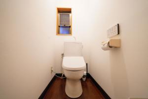 a bathroom with a white toilet in a room at Hideaway Hakone Sengokuhara in Sengokuhara +39 photos