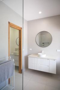 a bathroom with a sink and a mirror at Bloom by the Bend in Tooradin +56 photos