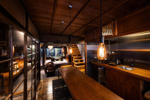 a bar with a wooden table in a room at Rinn Kyoto Imperial Palace South Kishoan in Kyoto