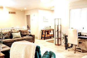 a living room with a couch and a table at The Gate City Grande in Pocatello