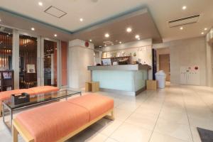 a store lobby with a bench and a bar at ホテルクオーレ敦賀 男性専用の大浴場サウナをご用意 in Tsuruga +61 photos