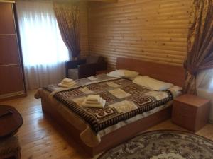 Postel nebo postele na pokoji v ubytování Sribni Rosy