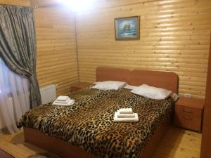 Postel nebo postele na pokoji v ubytování Sribni Rosy
