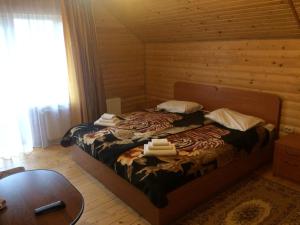 Postel nebo postele na pokoji v ubytování Sribni Rosy