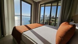 a bedroom with a bed in front of a window at Reev Coffee House in Antalya