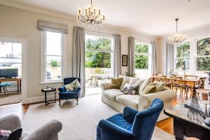 a living room with a couch and a table at Britannia Villa in Greytown