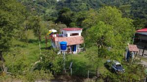 an aerial view of a house with a car in front at Mirador De Las Pirámides in Zetaquira