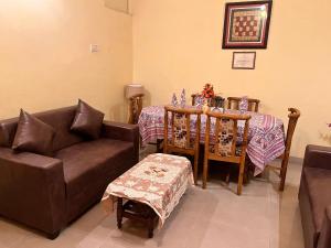 a living room with a couch and a table at Sheetal Homestay in Varanasi +16 photos