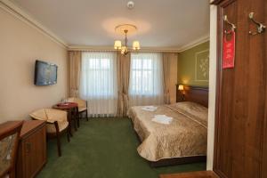 Postel nebo postele na pokoji v ubytování Hotel przy Młynie