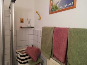 a bathroom with towels hanging on a rack at Appartement "Charming Harzburg" in Bad Harzburg