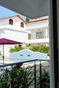 a view of a building from a balcony at River Deck Baga Beach Front in Calangute