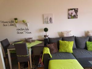 a living room with a couch and a table at Ferienwohnung Schnuffi Wolfgang Kresse in Bad Harzburg