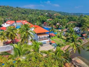 an aerial view of a resort with palm trees at River Deck Baga Beach Front in Calangute