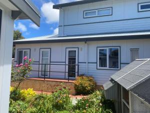 a blue and white house with a balcony at Southerly Studio in Augusta +9 photos