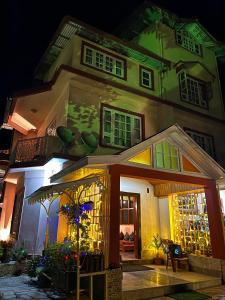 a house at night with a lit up at Ifseen Villa in Pelling
