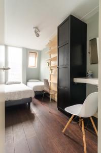 Postel nebo postele na pokoji v ubytování Marnix360apartments Top