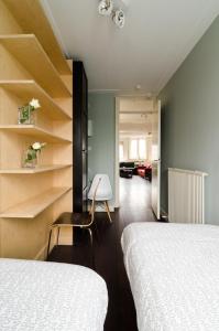 Postel nebo postele na pokoji v ubytování Marnix360apartments Top