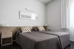 Postel nebo postele na pokoji v ubytování Residencia Universitaria Resa Roberto de Nobili + 27 fotografií