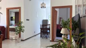 a living room with plants and a dining room at Handagedara Madiha Villa in Matara +8 photos