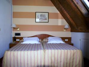 Posteľ alebo postele v izbe v ubytovaní Hotel Edelweiss
