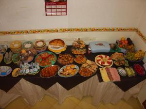 a table topped with lots of different types of food at Locanda Degli Agrumi in Conca dei Marini