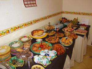 a table with many different types of food on it at Locanda Degli Agrumi in Conca dei Marini