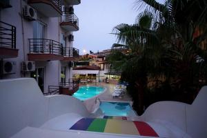 a view of a swimming pool in a hotel at Aybel İnn Hotel in Beldibi