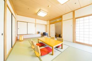 a dining room with a table and chairs at Hotel Hiroshima Sunplaza in Hiroshima