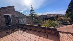 a brick house with a brick retaining wall at Chalet en La Rioja para familias y grupos in Tricio +18 photos