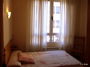 Postel nebo postele na pokoji v ubytování Hostal Orejas