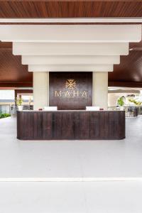 a lobby of a mall with a sign on it at Maha Resort Bali in Canggu +83 photos