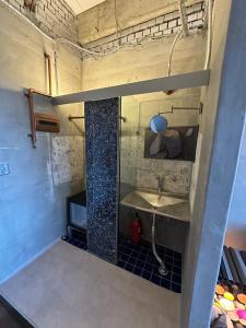 a bathroom with a sink in a room at 명파아트호텔 in Chŏjil-li +50 photos