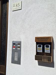 a cash retrieval instrument on the side of a building at Casa Travaglianti - Letojanni Taormina in Letojanni