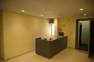 a lobby with a reception desk in a building at hotel NemiResidency in Jagdalpur