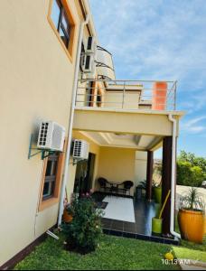 a view of a house with a balcony and a patio at Voyager Inn-Hotel in Palatswe