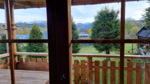a view from the window of a cabin at Domki Szwajnosówka in Witów