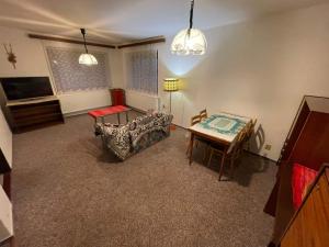 a living room with a couch and a table at Apartmán Votoček in Rokytnice nad Jizerou