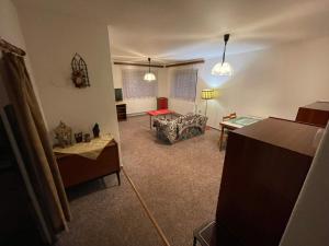 a living room with a couch and a table at Apartmán Votoček in Rokytnice nad Jizerou